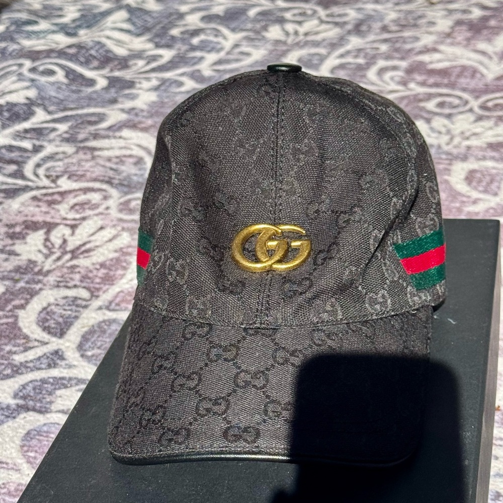 Gucci Black Hat with Gold Emblem
